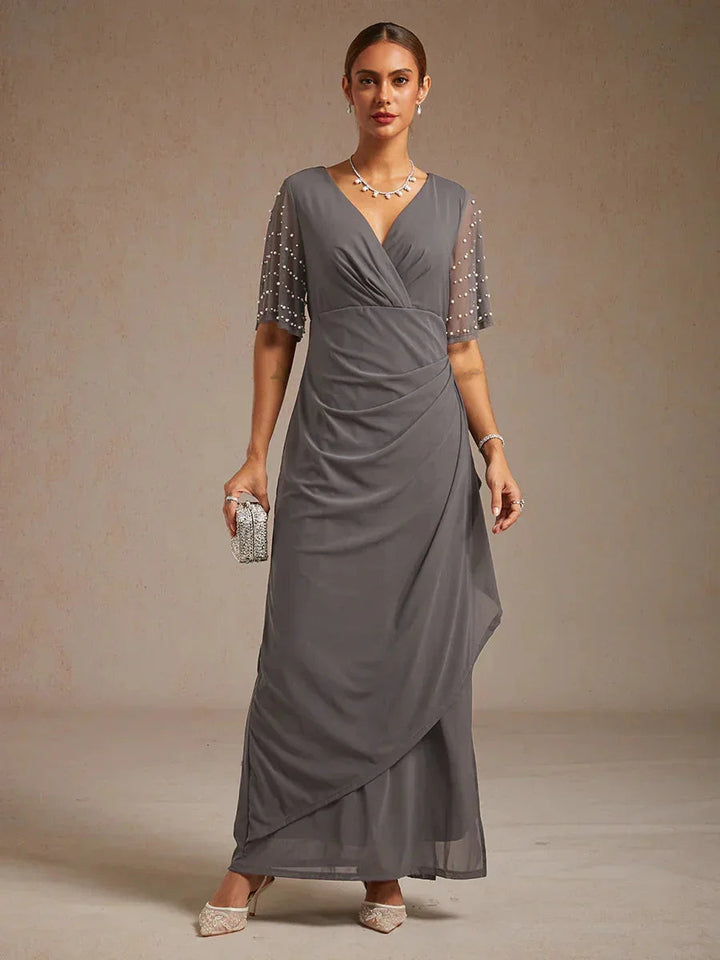 Elegante Formele Galajurk met Versierde Fladdermouwen