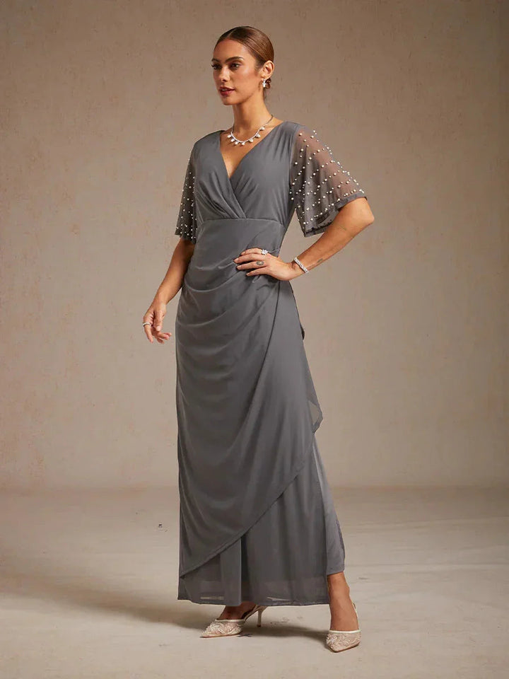 Elegante Formele Galajurk met Versierde Fladdermouwen