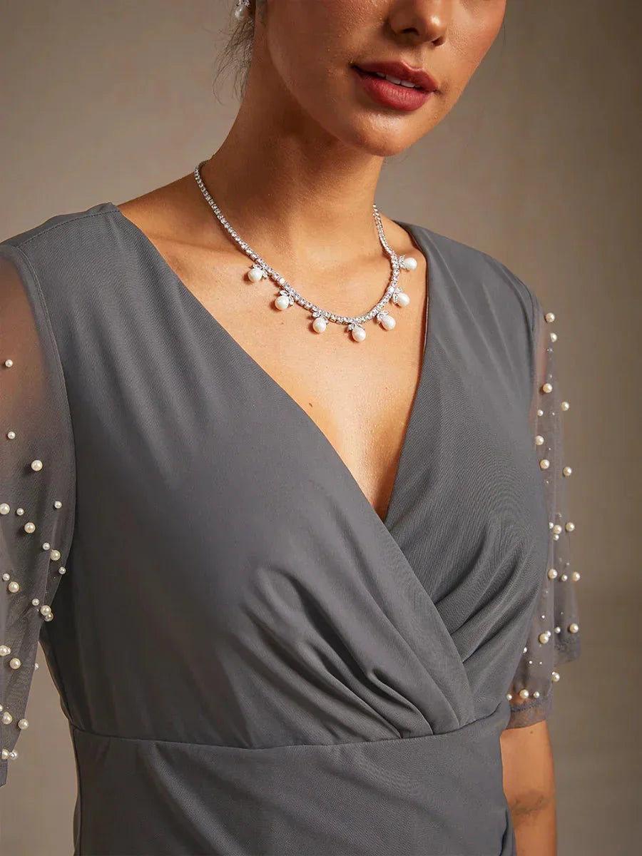 Elegante Formele Galajurk met Versierde Fladdermouwen
