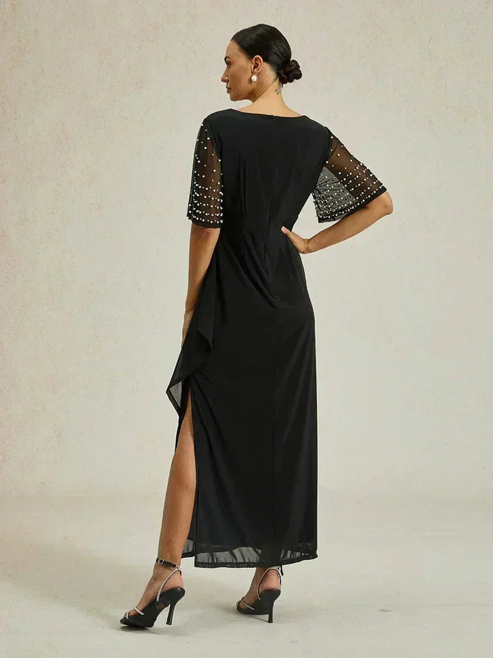Elegante Formele Galajurk met Versierde Fladdermouwen